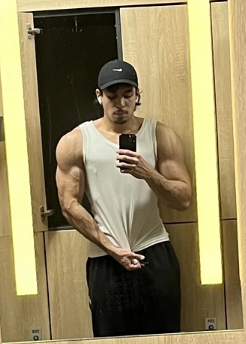 dex now, same gym mirror, in a tank top